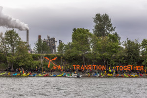 Just Transition kayaks outside shell refinery in Anacortes